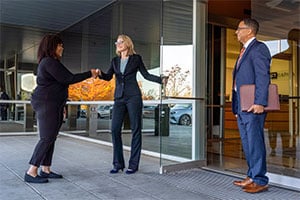 Photo of client and attorneys